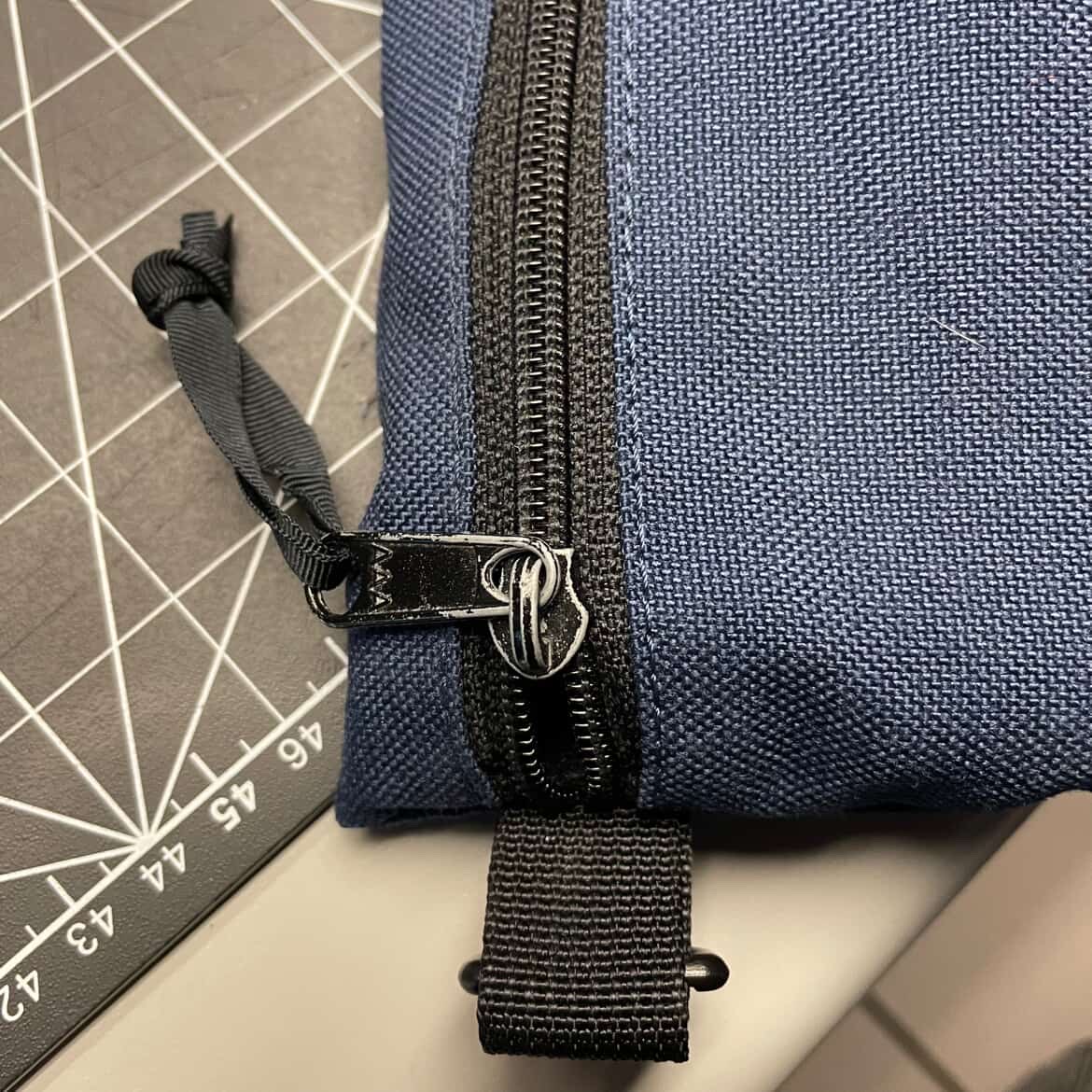 An interaction depicting the zipping and unzipping of a zipper on a pencil case.