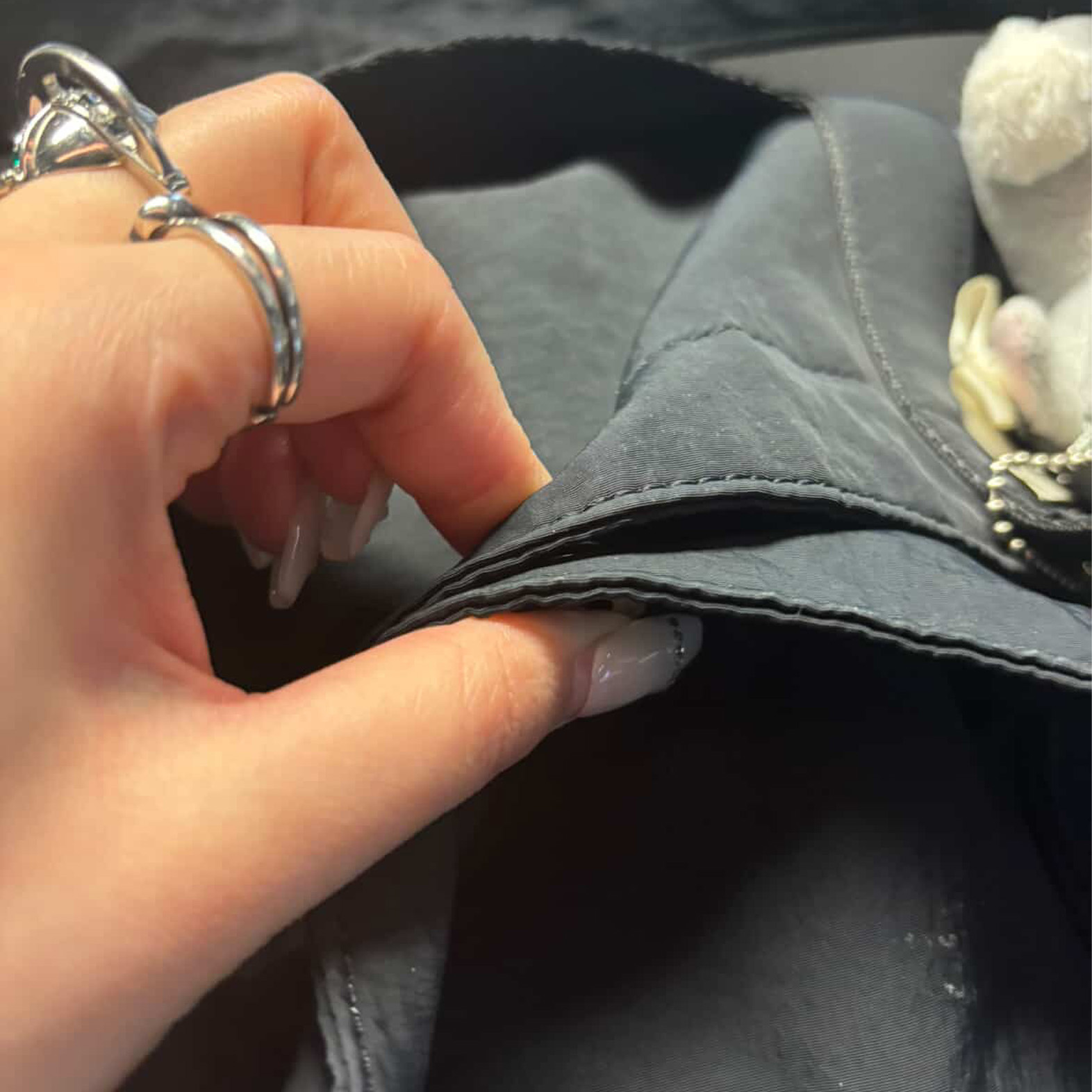 An interaction depicting the opening and closing of a jacket button. There is potential for a circuit to be formed that activates once the button is closed.