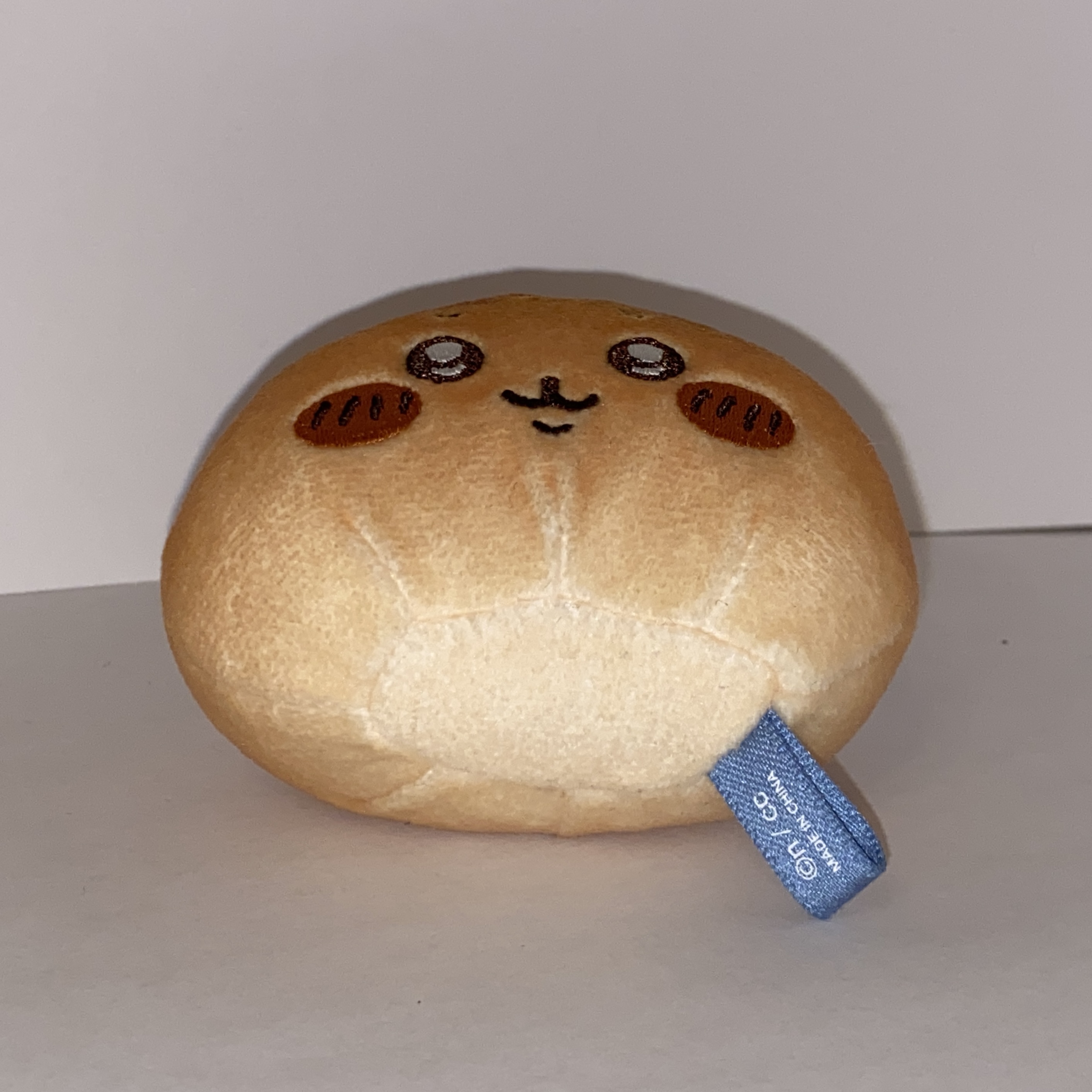 Image of a small round plushie.
